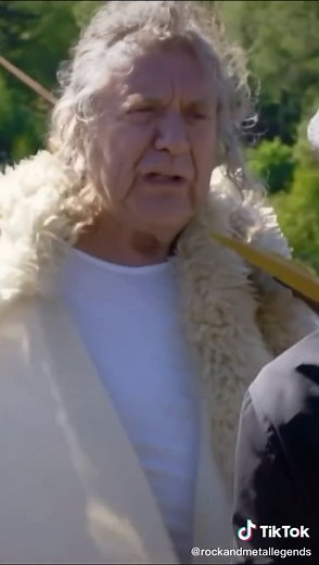 robert plant greets brian johnson in whales, england where led zeppelin filmed part of the movie