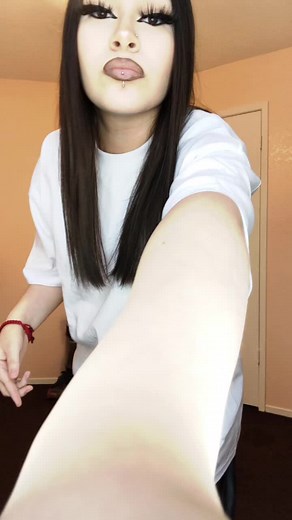 Arm Movement Demonstration in Stylish Outfit