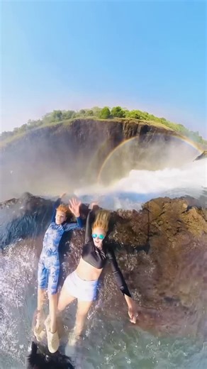 Marilu Peña on Instagram: "On the edge of the world 🌍💦 Standing at the lip of Victoria Falls in Devil’s Pool — nature’s ultimate infinity pool! Would you dare to swim here? 😱🇿🇲 #DevilsPool #Zambia #VictoriaFalls #BucketListAdventure” #travelwithkids #familytravel"