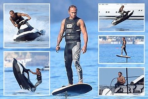 F1 ace Lewis Hamilton appears to levitate as he's pictured on hydrofoil board