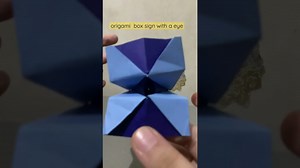 origami box sign with a eye close and open – Dominic D