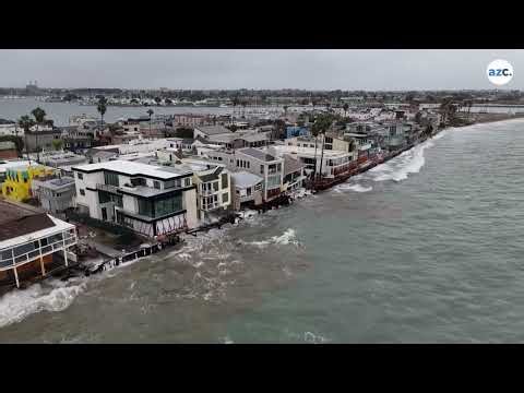 Drone footage shows waves batter homes and coastline in Southern California