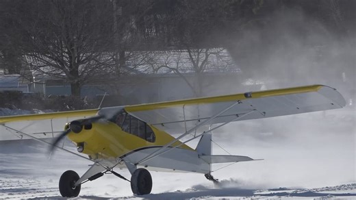 Crowds gather at Dover-Foxcroft's first ski plane fly-in for winter aviation spectacle