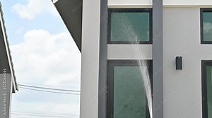 Engineer using hose for testing window leak by spray water. Home inspection concepts. The home inspection is your last chance to uncover defects with the house.