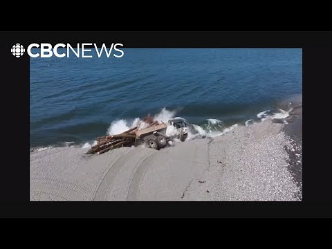 Dramatic shoreline collapse sends huge truck into B.C. lake