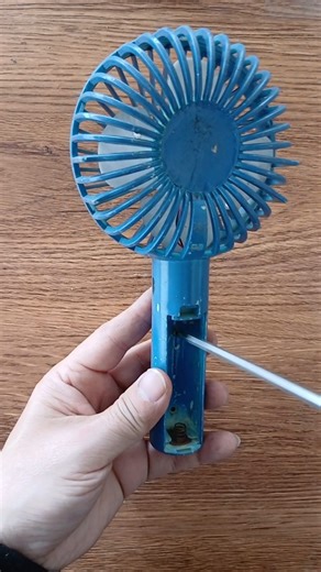 Repairing a non-working handheld mini fan.