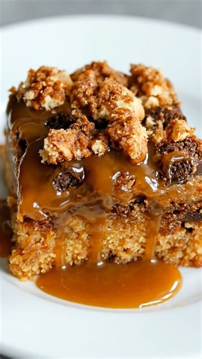 🍯 Ooey Gooey Toffee Cake | Sticky, buttery, and dripping with cozy sweetness 🤎 This **ooey gooey toffee cake** is the kind of dessert that feels downright indulgent from the very first bite. Soft, tender cake baked with rich toffee bits, then finished with a glossy caramel drizzle and buttery crumble that sinks right into the top. It’s warm, comforting, and intentionally messy — the center stays gooey, the edges turn golden, and every slice feels like something you’d splurge on at a bakery cou