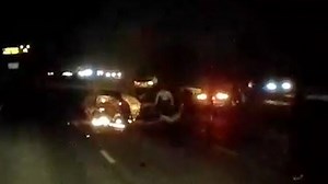Trucker drags woman from car wreck as it goes up in flames