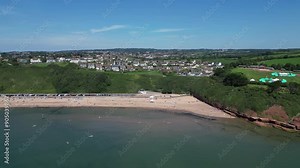 Exmouth, East Devon, England: DRONE VIEWS: Exmouth beach close to the start of the Jurassic Coast. Exmouth is a popular UK holiday destination and a magnet for water sports enthusiasts (Clip 1).
