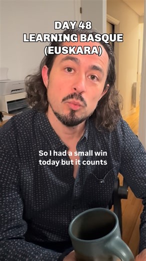 Scott Zúñiga on Instagram: "Day 48 of 365 learning Euskara the Basque language. Today I trained: polite persistence. Staying in Basque even when someone doesn’t speak if I get the vibe that they don’t mind. Today I used it: “Oso ondo,” “Ogi txiki bat, mesedez.” Meaning: “it’s very good” and “a small bread, please.” Where I used it: my local okindegia. (Bakery) What happened: after a few visits, the employee who I see every day at the counter started repeating Basque back to me even though she do