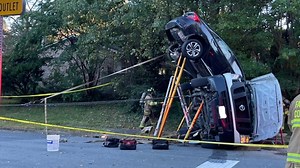Two vehicle collision leaves one car off the ground, two injured