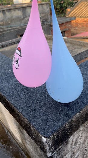 Experiment: Will a water balloon explode if it rolls down a tall building? 💥🎈 #balloon