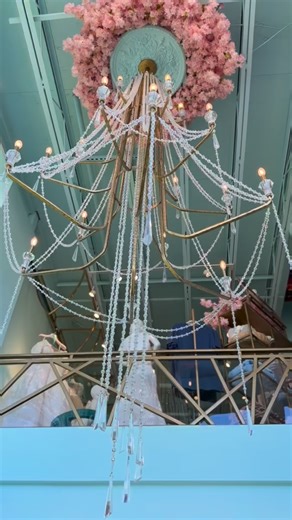 Under this chandelier, countless dream dresses come true. #sposamiacouture #sposamiacouturetx #bridetobe #onlyatsposamia #weddingdressshopping #brides #bridalfashion #bridalfashion #weddingstyle | Sposa Mia Couture