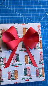 205K views · 1K reactions |  How to make a Paper Bow! Delightful paper folding craft perfect for gifting and decorating! #Christmas #crafting #origami #handmade #bows | Jeff & Lauren | Facebook