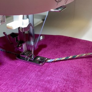 19K views · 112 reactions | Y is for Yarn Couching! Attach the Rolled Hem Foot. Select a zigzag stitch and adjust stitch width as needed. Place stabilizer behind the fabric. Feed the yarn into the scroll of the foot. | Singer North America | Facebook