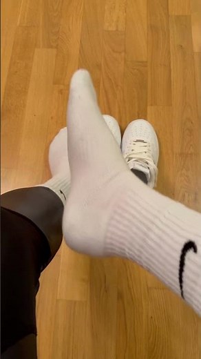 Dirty white Nike Socks on feet with Nylon Leggings