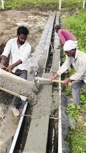 “Concrete pouring done in seconds! 💪 Watch how we build this open drain wall with instant concrete 🚧