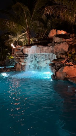This South Florida Insane Pool shines bright at night. We create a jaw-dropping environment of recreation and relaxation that is 100% customized and unique to every client! #insanepools #lucaslagoons #poolbuilder #pool #backyard | Lucas Lagoons