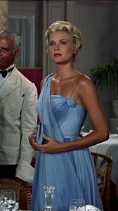 Vintage Old Cinema on Instagram: "Grace Kelly in 1955's 'To Catch a Thief', in this stunning chiffon dress designed by Edith Head. This ice blue floor length gown, complete with a fitted bodice and matching drape, was Head's own rendition of the New Look fashion movement at that time."