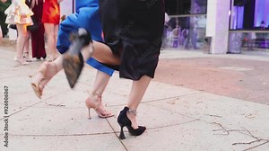 High school graduates dancing on prom, waltz and classical ball dance in dresses and suits on school graduation party, girls and boys classical ballroom dancers, couples dance quadrille and polonaise