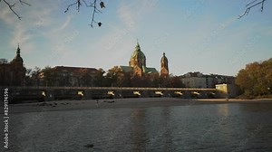 St. Luke Church near Isar river and Wehrsteg bridge, Munich, Germany. Church of Saint Lucas, Isar river, Lehel, Munchen, Upper Bavaria, Bavaria, Germany. Wehrsteg bridge. Saint Lukas dome cathedral.