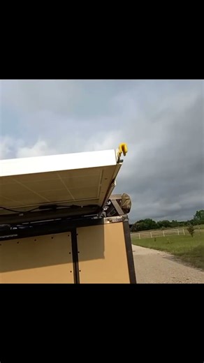 Construct a retractable solar panel for the motorhome roof