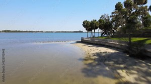 Ascending drone footage over Tampa and St.Pete beach align with trees, Florida