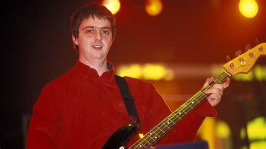 Discover more about Oasis bassist Paul 'Guigsy' McGuigan