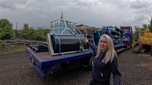 Unloading a full trailer in a lay-by after the ferry