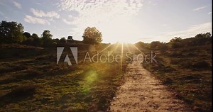 Slow motion POV shot of a person walking. An outdoor adventure by sunrise.