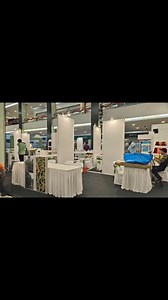 Shell scheme booth design and setup Carpeting Stage backdrop Display rack #eventdecor #eventsupplies | Times2 Event | Facebook