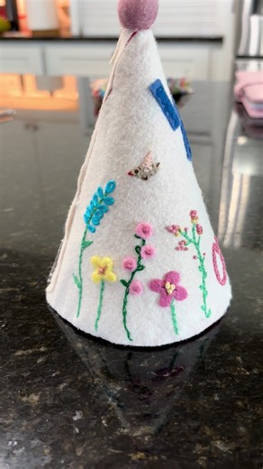 Felt birthday hats for my grandchildren is a new obsession! 💕. This was for a sweet girl’s half birthday photos and was made using felt appliqué embroidery. #feltapplique #feltbirthdaycrowns #birthdayhats #birthdaygirl