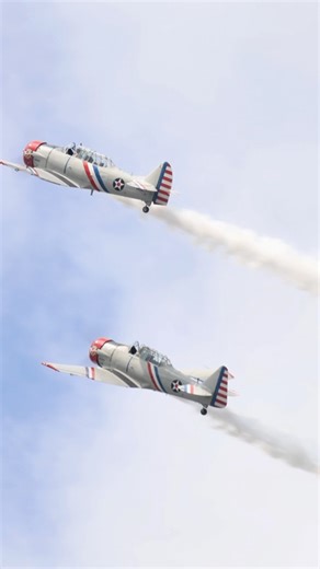 Warbird Thunder! Two SNJs in a Tight Formation Roll with the characteristic SNJ/T-6 growl echoing through the sky. These guys fly an awesome show and 2026 marks their venture into Twilight Airshows too! If you didn’t see them this year, make sure you do in 2026! #warbirdthunder #t6 #wwii #history #formation | Ryan Tykosh Photography