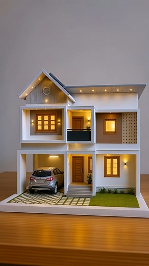 This beautiful modern Kerala house design is pure elegance Perfect proportions, warm lighting, car porch, balcony with clean lines — everything feels just right. Imagine coming home to this every day ➡️ Like & Share if you loved the design! #KeralaHouseDesign #HomeDesign #ModernArchitecture #KeralaHomes | KeralaHomeDesign