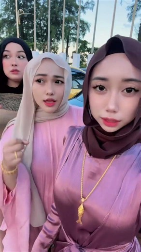 The Beauty of Three Hijabi Girls in Stunning Satin Baju Kurung