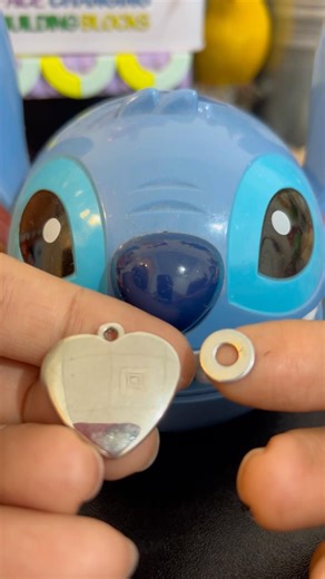 Angry lilo stitch eating a metal heart and tiny ring circle #metal #asmrsounds #satisfying