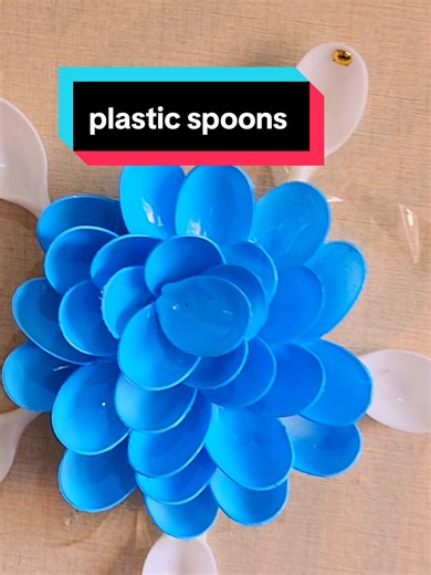 did u know u can use plastic spoons to make this? learn woth me today 07.40.32.87.89 call or text for al materials used in this video #bottlecraft #diyflower #schoolproject #plasticspoons #artandcrafts