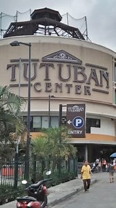 Tutuban Center in Manila, Philippines, is a historic and commercial hub. Originally opened as the Tutuban Train Station in 1887, it played a key role in transportation and economic growth during the Spanish and American colonial periods. The station even served as a makeshift hospital during World War II. As rail transport declined, the area deteriorated until a redevelopment project in the late 1990s transformed it into a modern commercial center, preserving its historical architecture. Tutuban