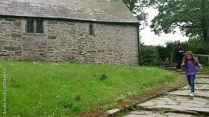 Tourists at the Chapel of Saint Piran is a long construction in Trethevy, in the anglican parish of Tintagel in Cornwall, Uk. Zoom out 4k footage