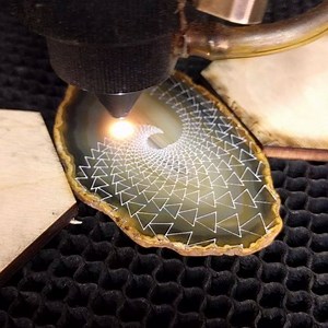 164K views · 1.2K reactions | Watching the laser work on agates is definitely a guilty pleasure. This one is so fun to watch, the design was made to work in a spiral just because it's awesome! Also note the intricacy, this agate is 3" x 2". | Laser Trees | Facebook