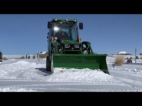 John Deere 1025R Warm Cab Satisfying Snow Removal