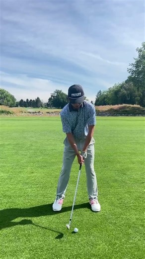 Iron swing front view in the golf course