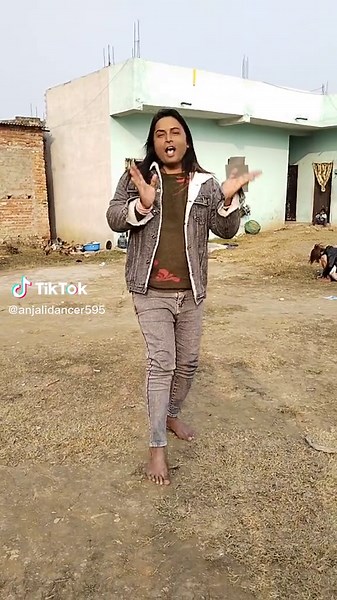 Outdoor Fashion Statement in Denim and Green Apparel