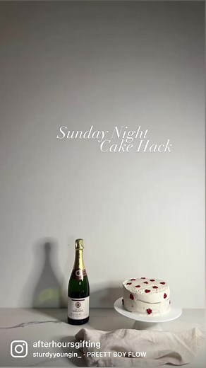 Grab a $6 ready made sponge from Woolies. You’ll also need buttercream icing if you don’t want to make it yourself. Other items required:- purple food colouring (if you make your own buttercream- mini m&m’s- Queens writing icing pack. 1. Cut the domes off each of the two sponges. 2. Place one of the sponges on a cake stand or plate and secure with icing. 3. Add a layer of buttercream to the sponge and make sure it’s relatively even. 4. Place the second sponge on top and spoon a big dollop of the