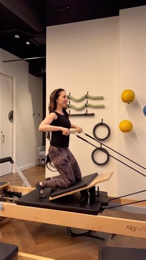 Athletic Reformer using the jumpboard, bar and heavy spring resistance.