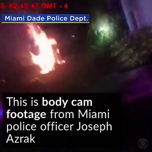 Dramatic body cam footage captures the moment an officer runs into a home and alerts a sleeping homeowners to a blaze outside http://cbsn.ws/2pIm481 | CBS News