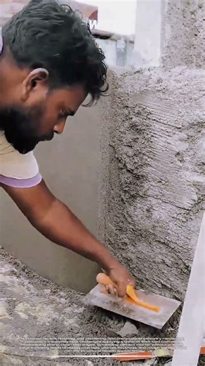 Exterior wall rendering technique: Skilled trowel cutting for clean edge plaster finishing