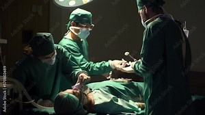 Female surgeon team and male surgeon ready to operate on patients in hospital operating room.