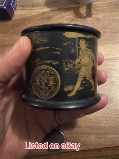Not a spoon but a beautiful black lacquer & gold paper-maiche trinket box I’ve also inherited. This is an antique Japanese black lacquer papier-mâché box, likely a tea caddy, snuff box, or trinket box, dating from the 19th century. It features intricate, hand-painted gold decoration depicting traditional figural scenes. The item is made from lacquered papier-mâché, which was common for such items in the Victorian era. The gold decoration on a black background is characteristic of the Chinoiserie