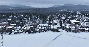 Afternoon winter aerial video of Mirror Lake in the Village of Lake Placid, New York. (01-05-2024)